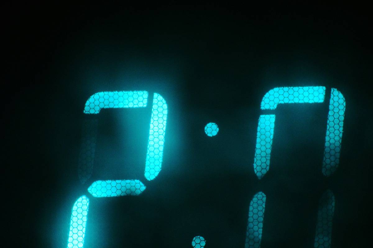 Smart clock displaying time, weather, and calendar events with voice assistant clock features enabled