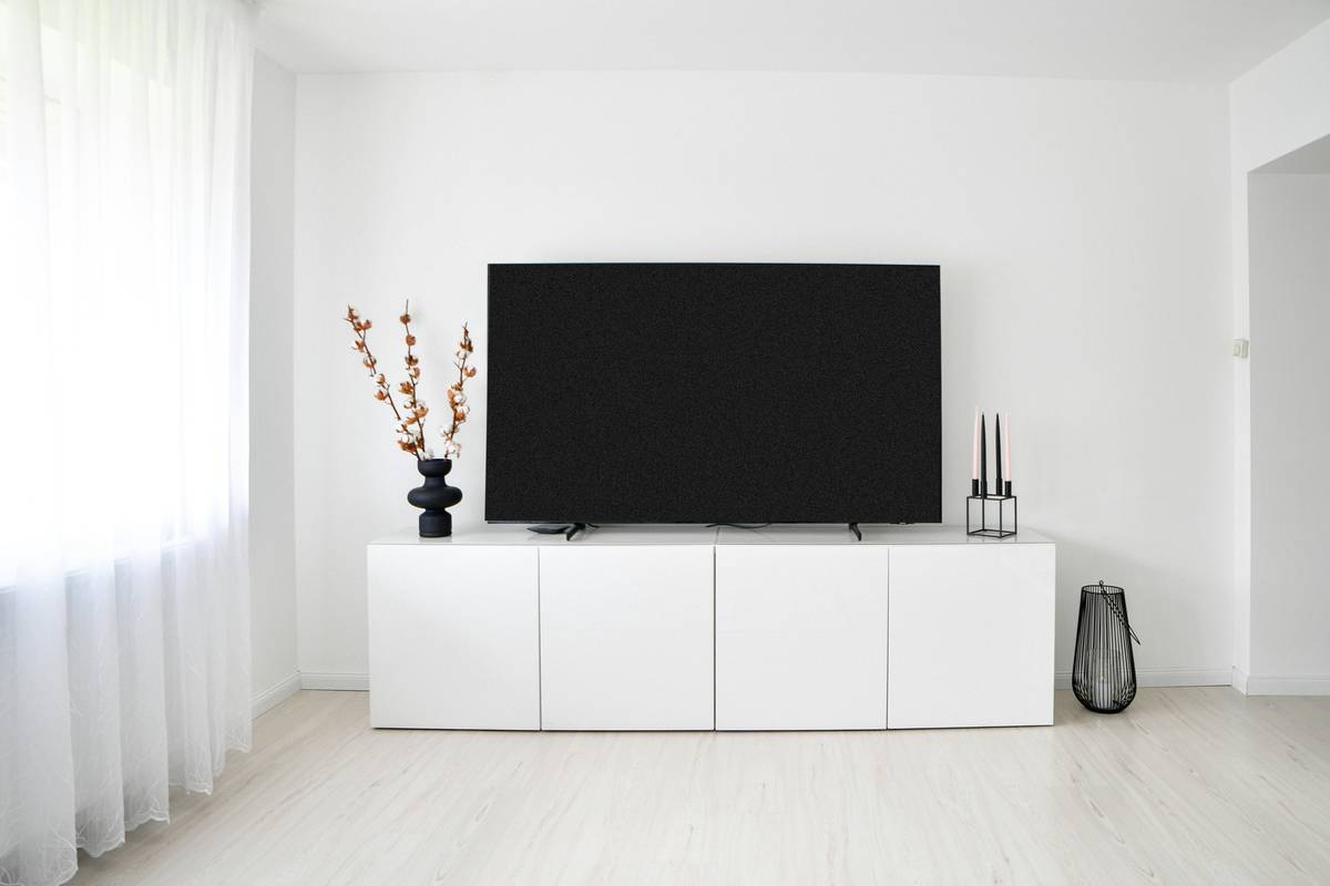 minimalist smart clock display showing only time and soft ambient glow on bedside table